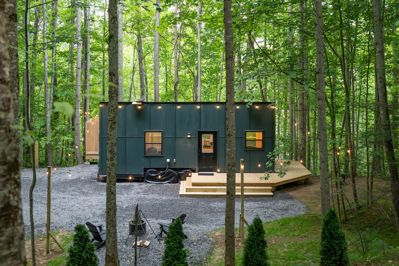 Brand new 2024 luxury tiny house in the dreamy Whisper Woods, equipped with an outdoor shower, fire pit,  soaking tub, and fireplace.