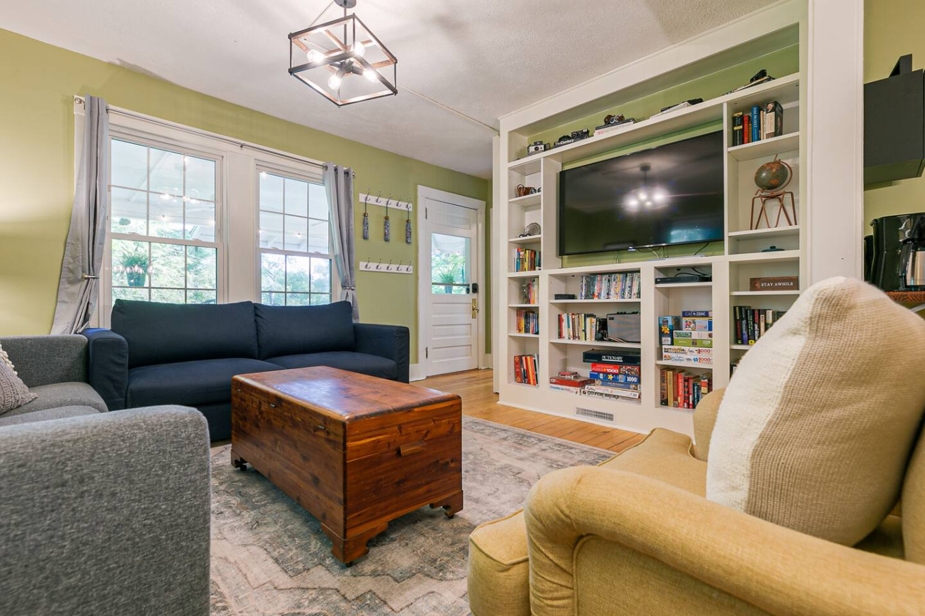 Kick back and relax in this cozy haven! Loving the vibe of this living room with plush couches and the perfect TV setup.