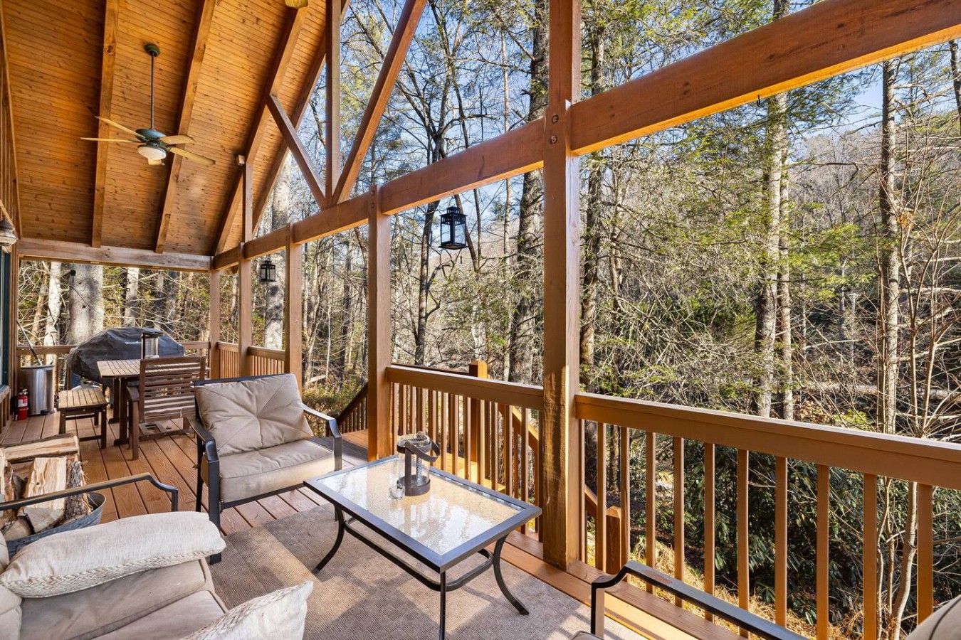 This airy living space seamlessly blends indoor comfort with outdoor vibes, perfect for cozy gatherings or serene moments.