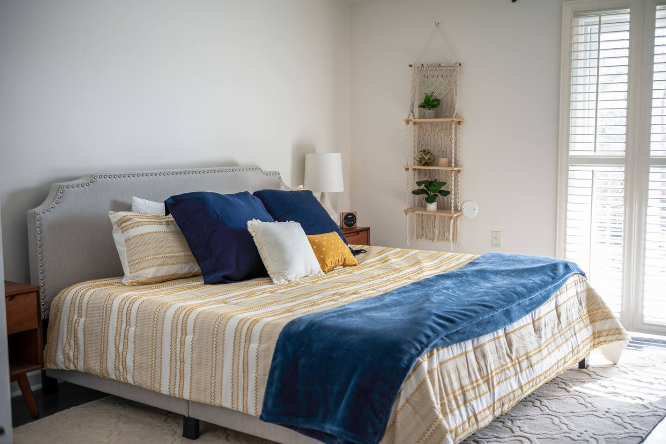 Bedroom on the bottom floor with electric fireplace
