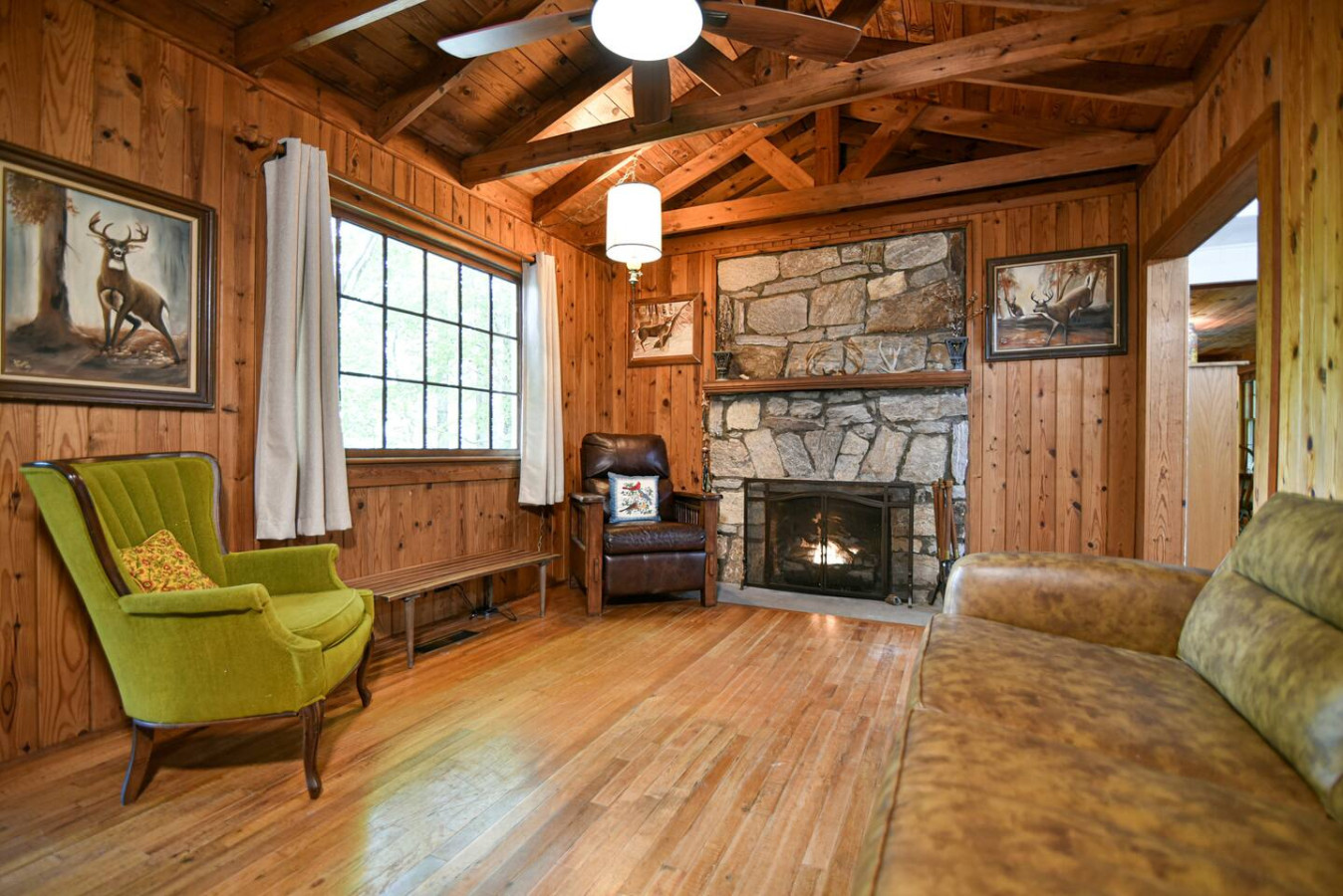 This fireplace features the signature work of the local stone mason in 1942. The family of this builder is an active part of our lovely community to this day. We are proud to have this part of history in our cabin.