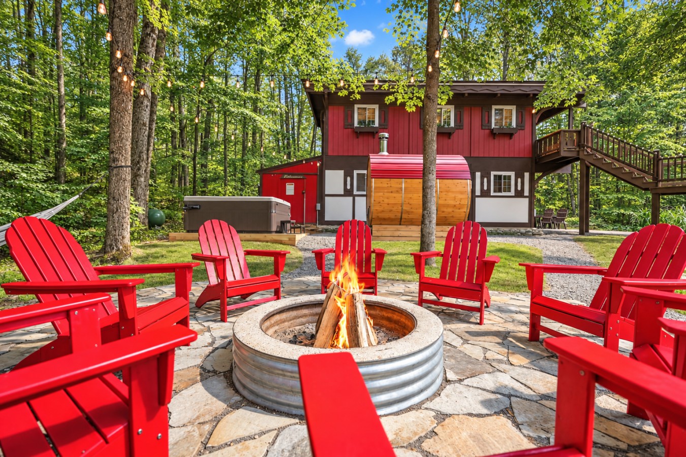 Chalet Getaway: Fire pit with red Adirondack chairs