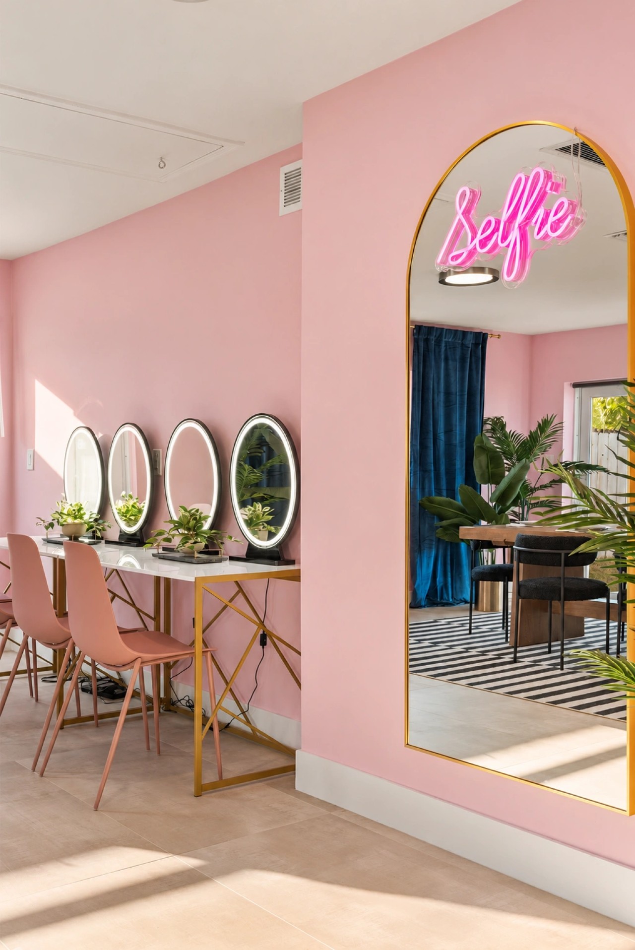 Pink get-ready room with mirrored styling stations