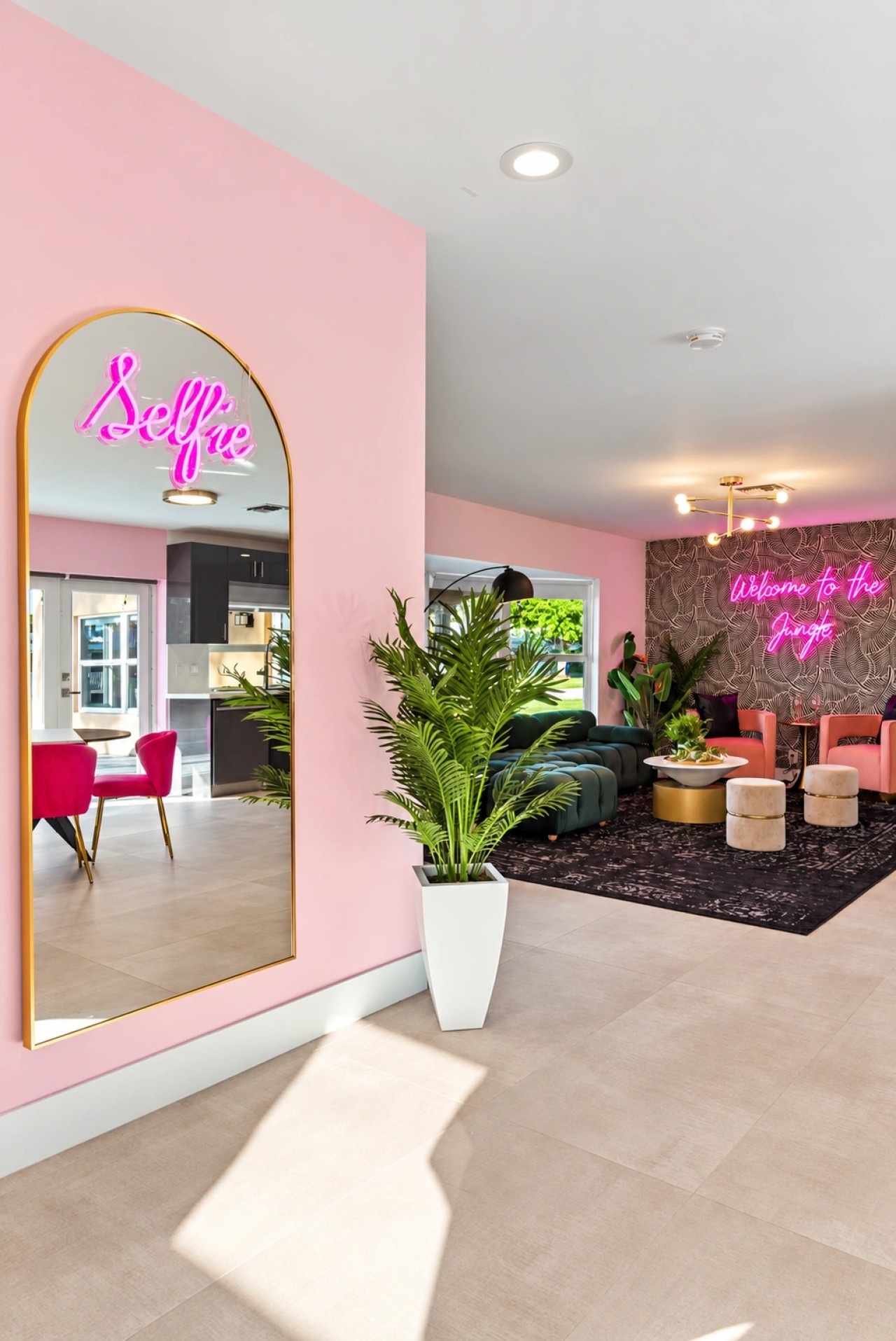 Pink get-ready room with mirrored styling stations
