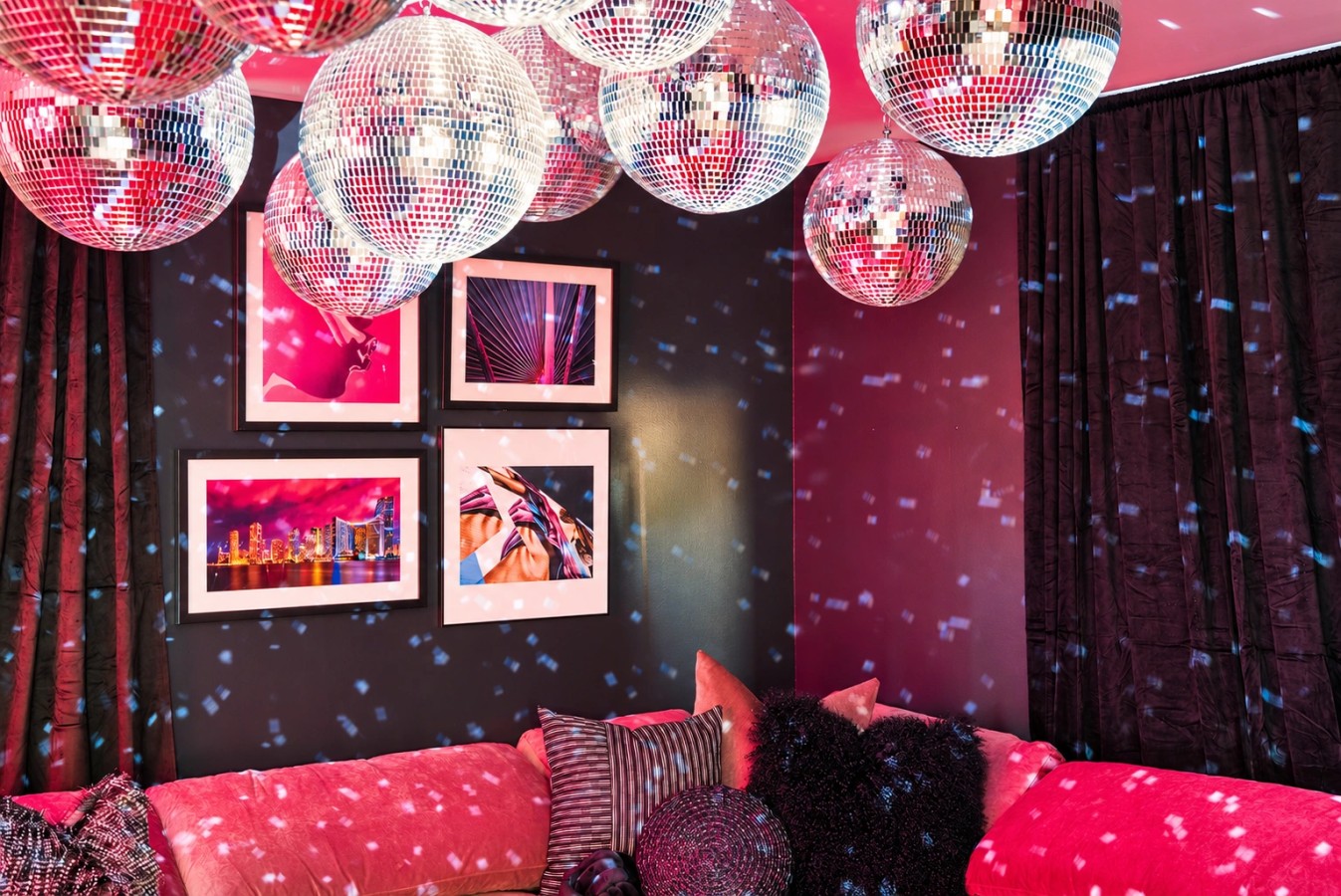Karaoke room with disco balls and neon lighting