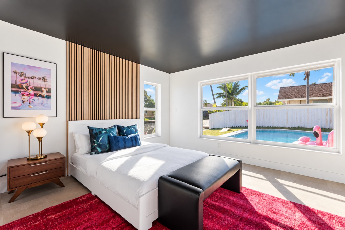 The Jungle: Bedroom with gray bedding and pink rug