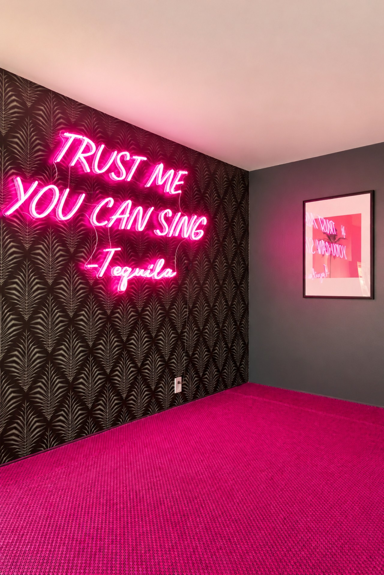 Karaoke room with disco balls and neon lighting