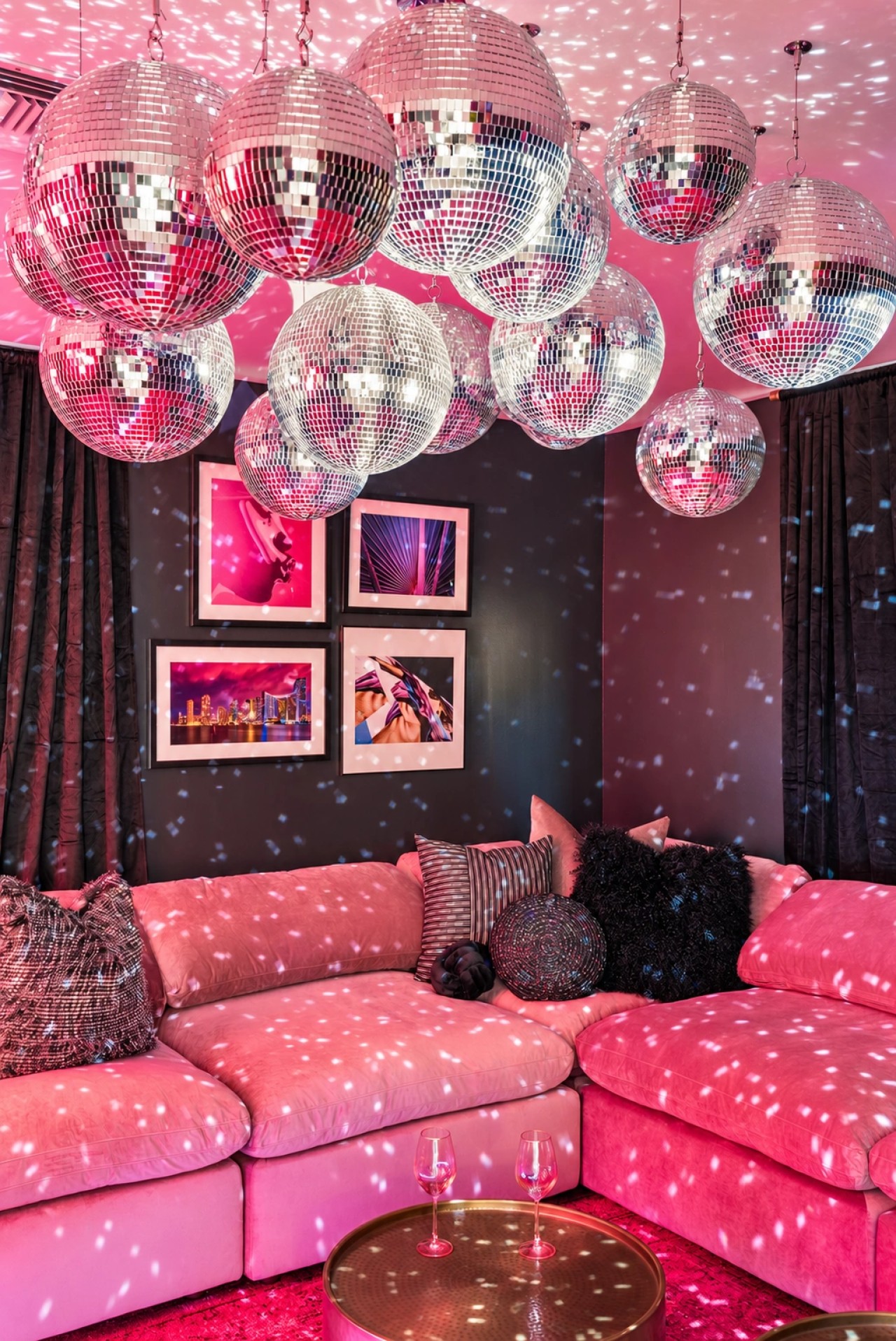Karaoke room with disco balls and neon lighting