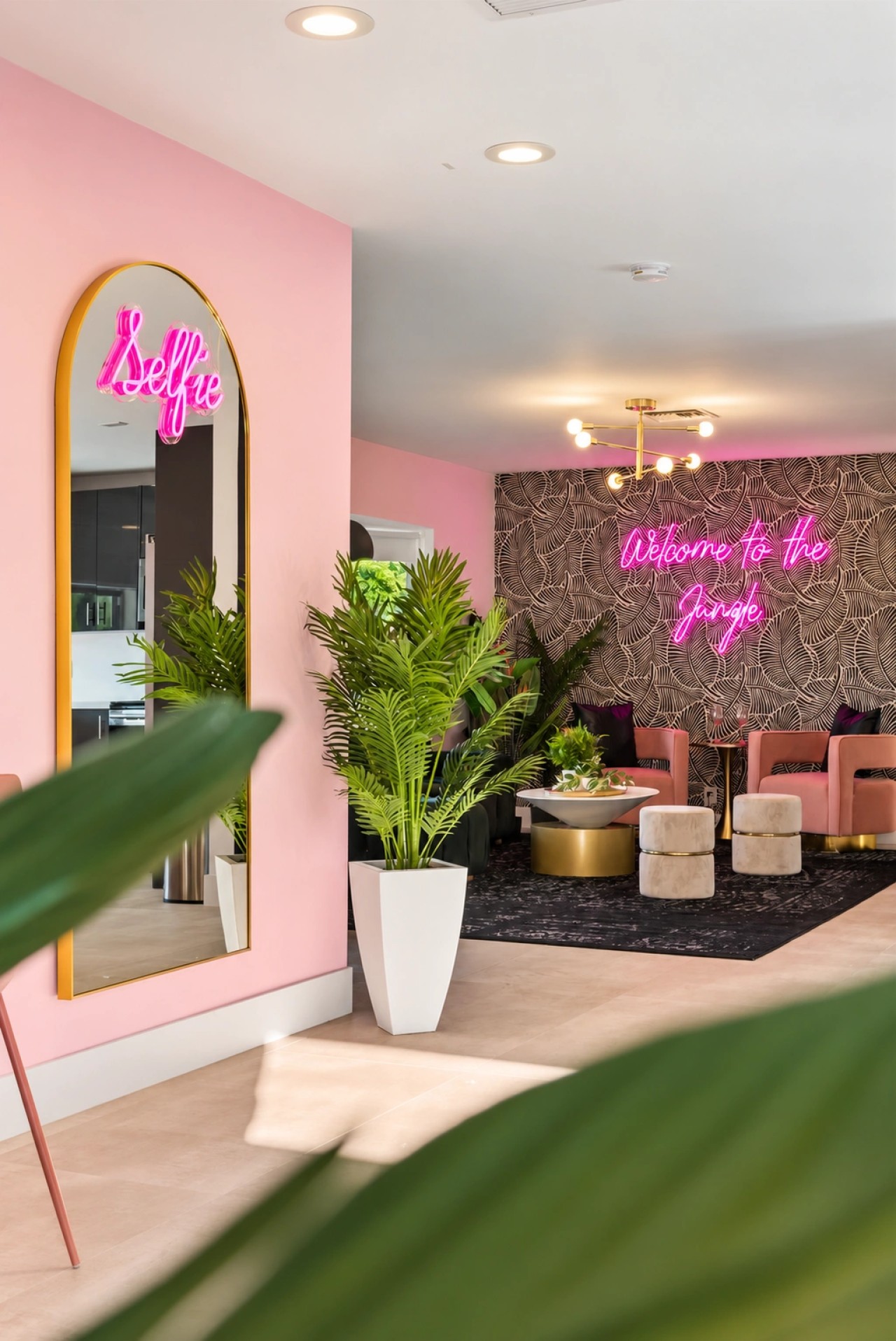 Pink get-ready room with mirrored styling stations