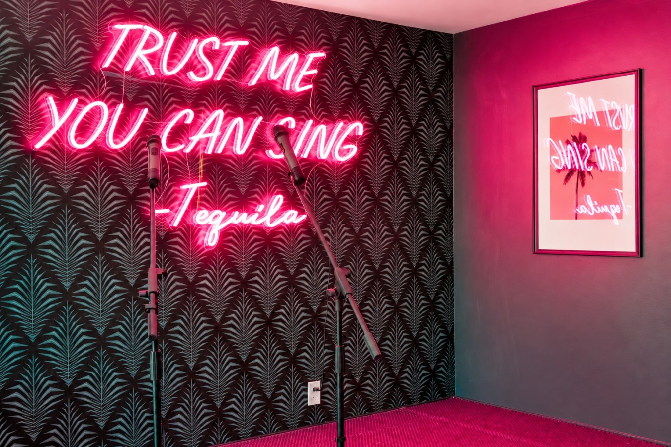 Karaoke room with disco balls and neon lighting
