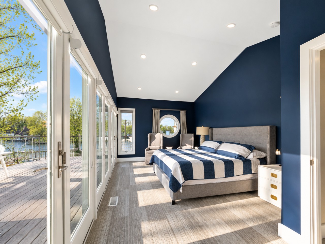 A restful bedroom with river-facing windows