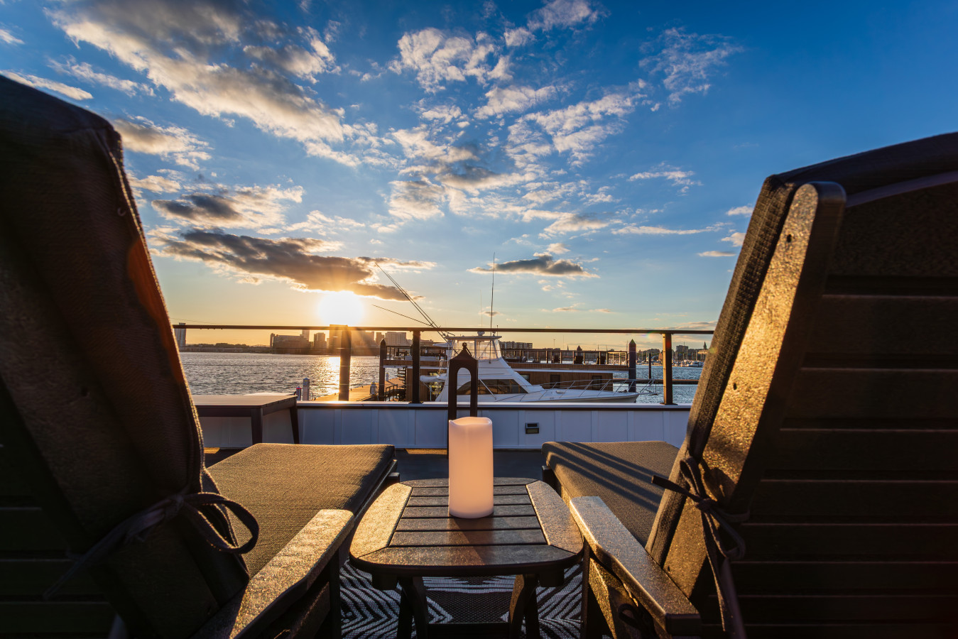 Relax in the lounge chairs on the rooftop as the sun dips behind the marina — the perfect end to any day.