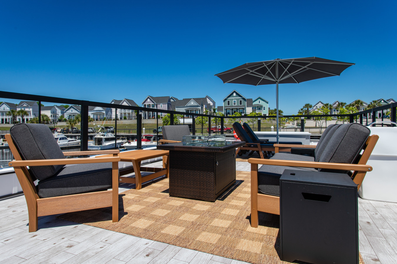 The rooftop fire pit and lounge seating in full daylight.
