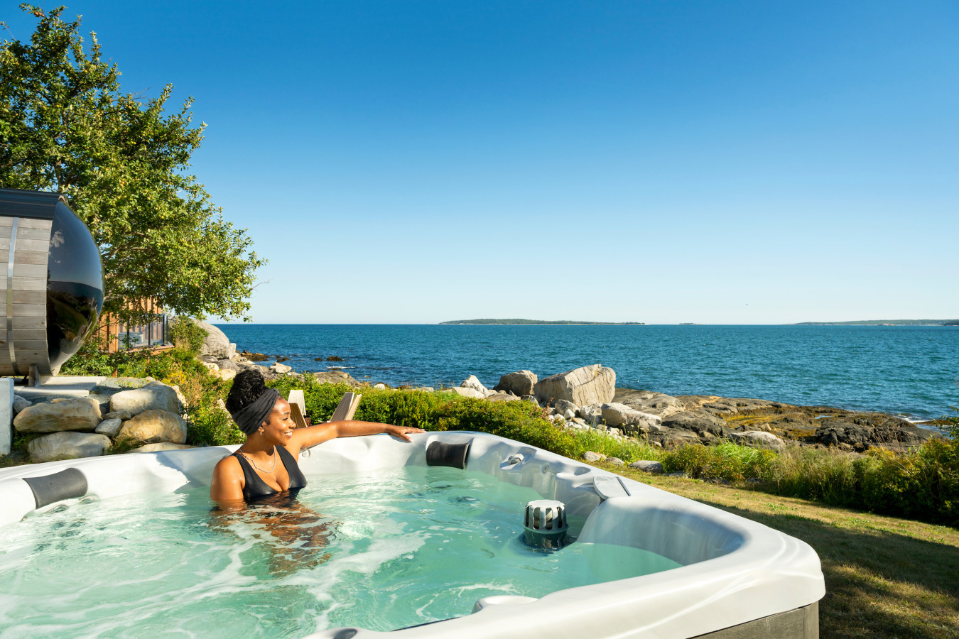 A girl in a pool on a hill on an island