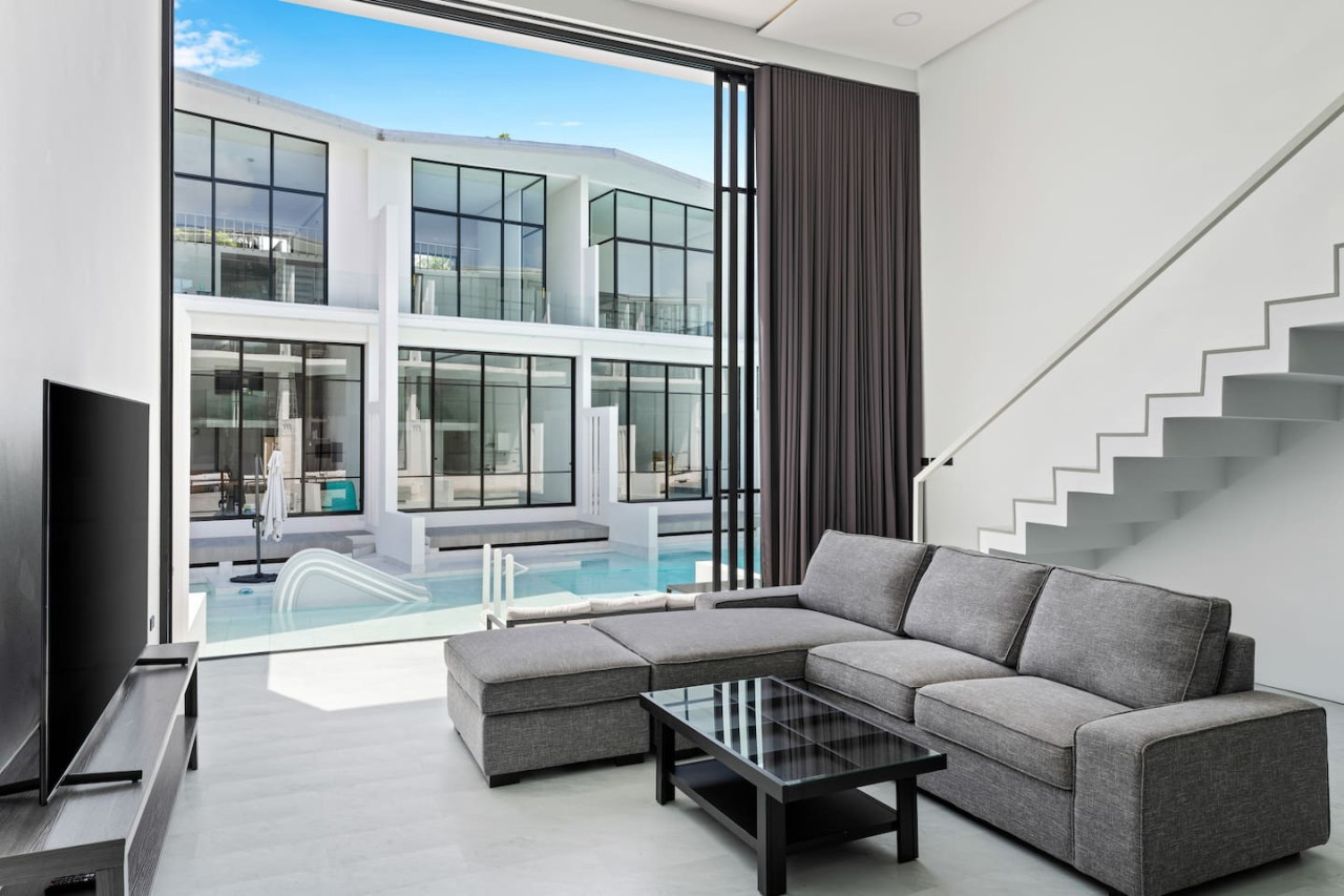 Spacious living room with sofa at C'est la Vie, Replay Residence Koh Samui