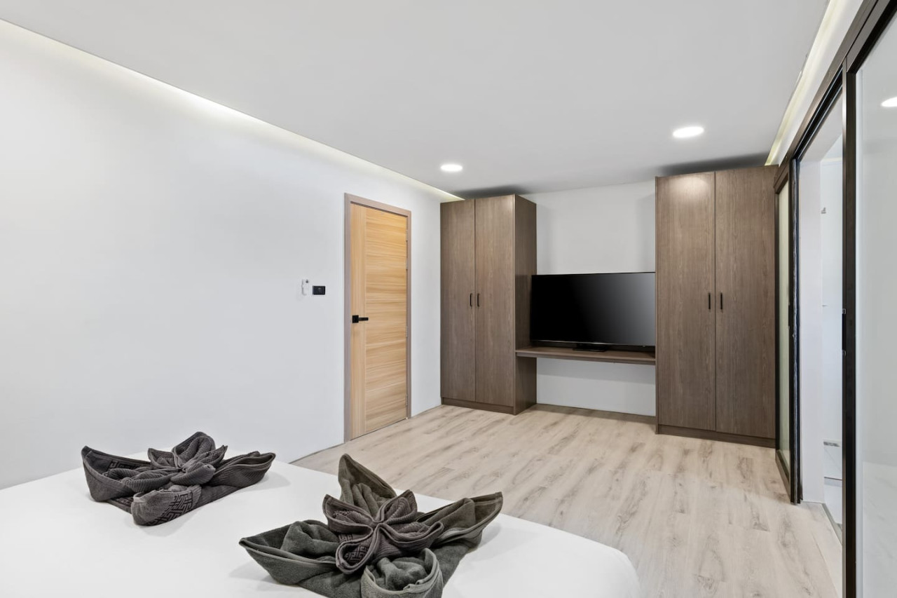 Entertainment area with smart TV and comfortable sofa in this Koh Samui 3-bedroom rental