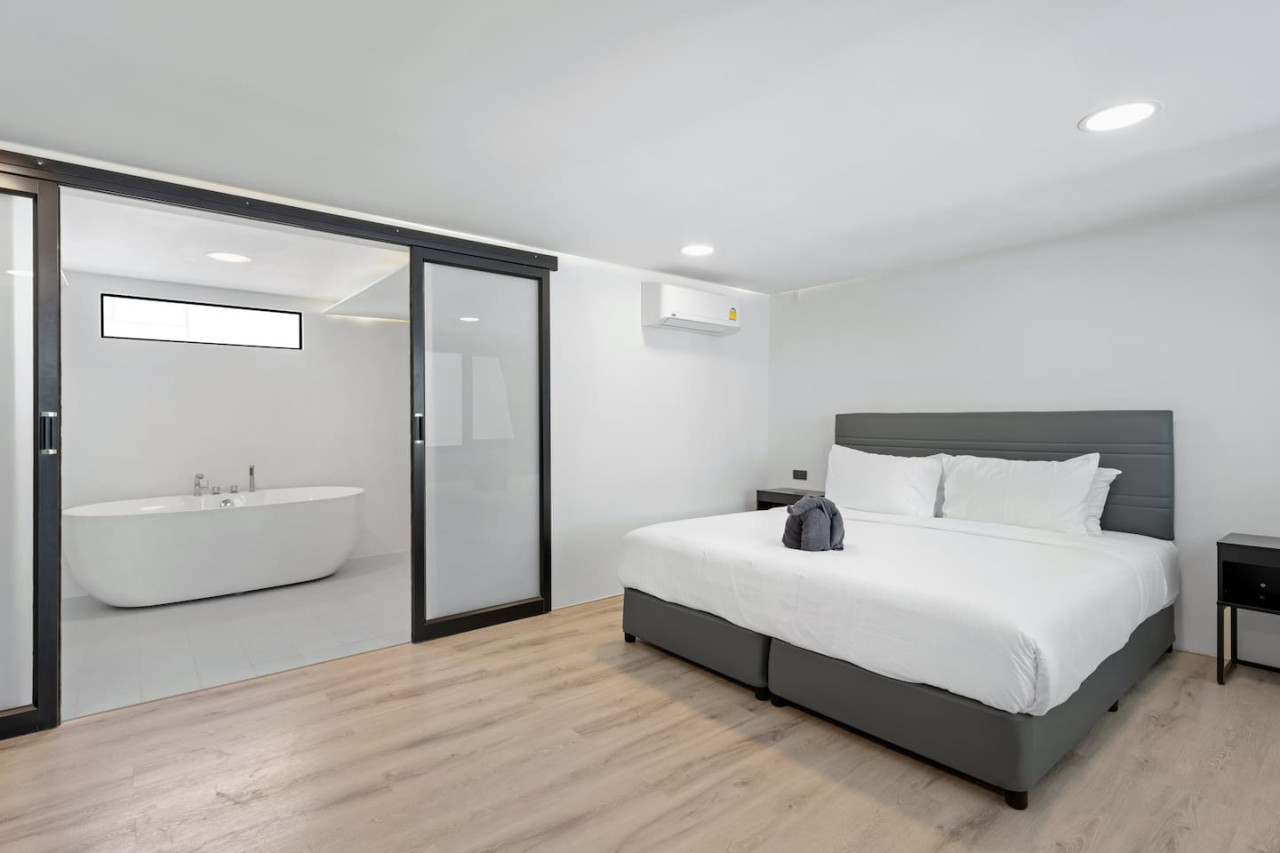 Serene king bedroom with natural light and minimalist style near Bang Rak Beach Koh Samui