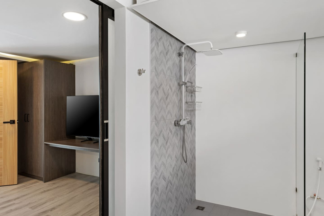 Luxurious bathroom with freestanding bathtub perfect for relaxing after a day at the beach