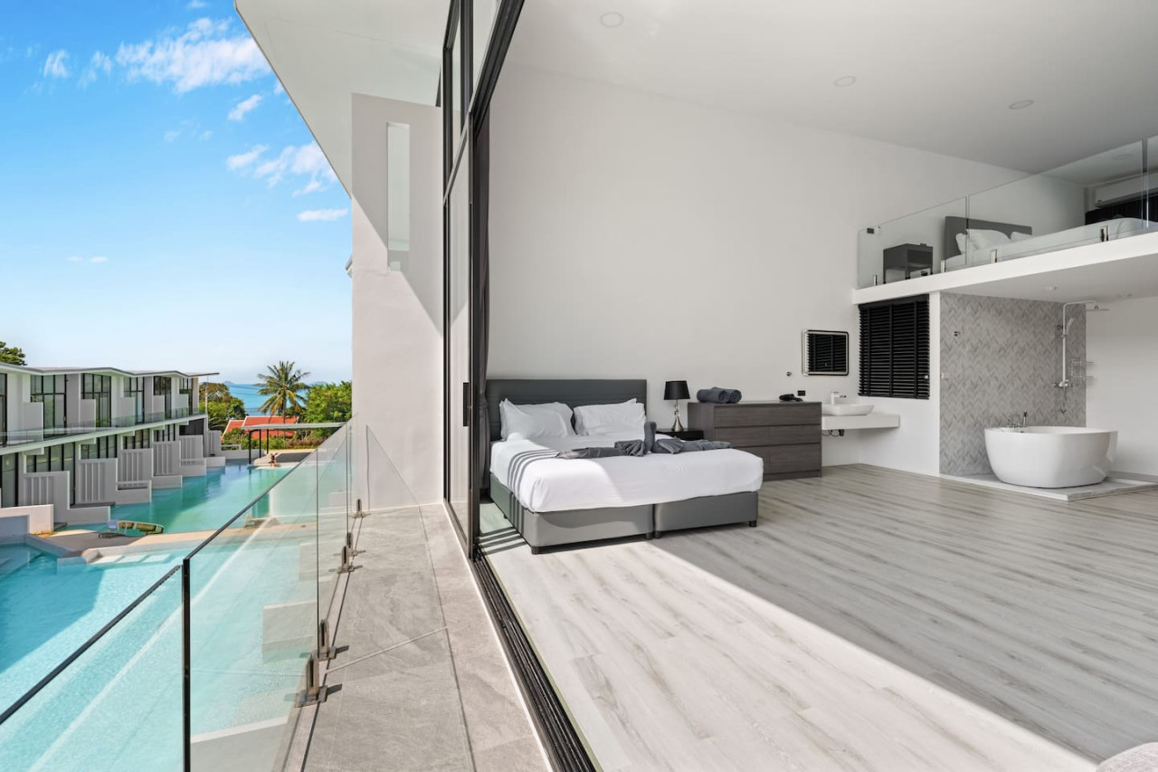 Sleek modern architecture of Replay C'est La Vie villa with tropical garden surroundings