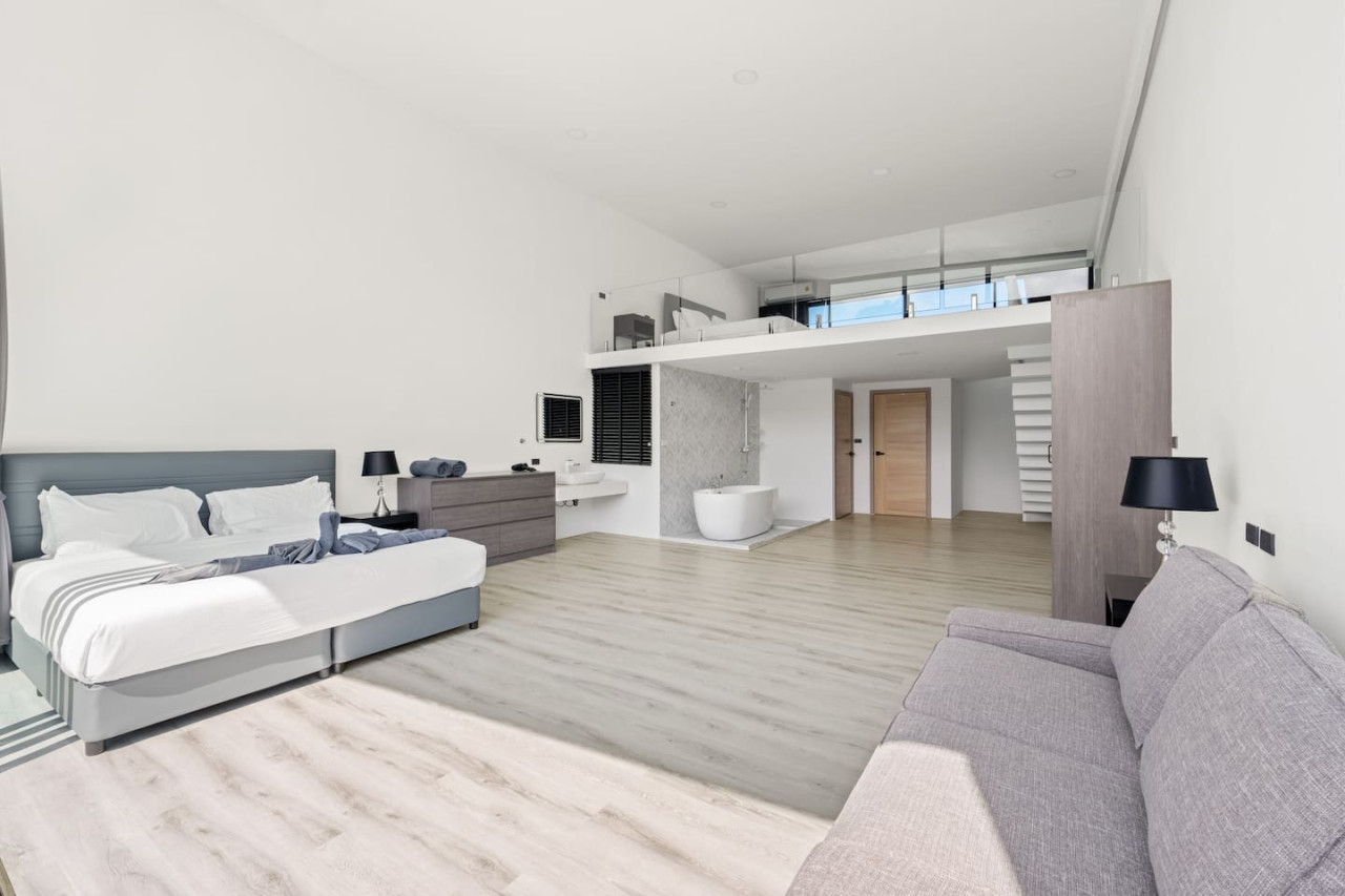 Bright and clean interiors with modern finishes throughout this Replay Residence Samui condo