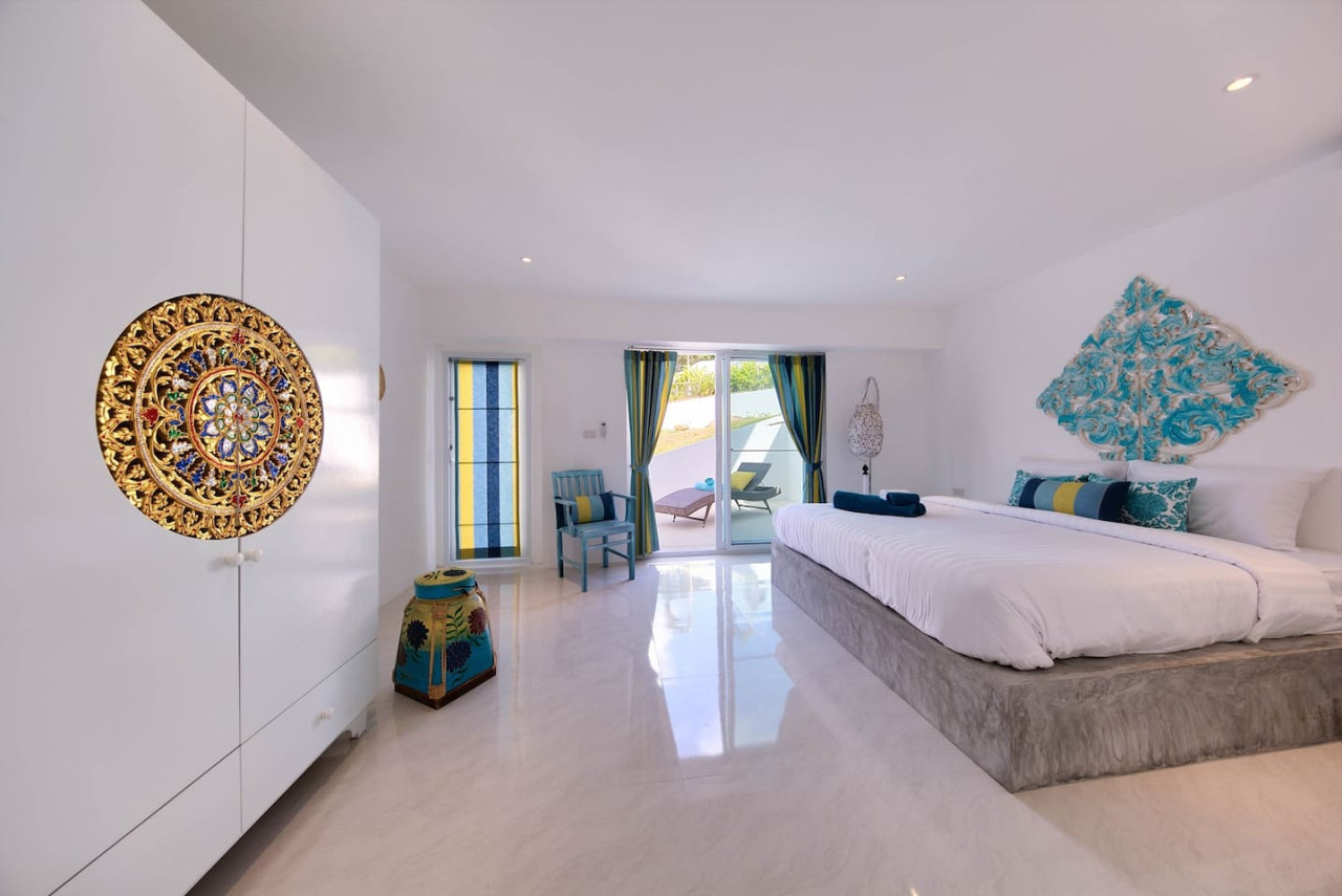 Minimalist white bedroom with modern amenities Thongsong Bay villa