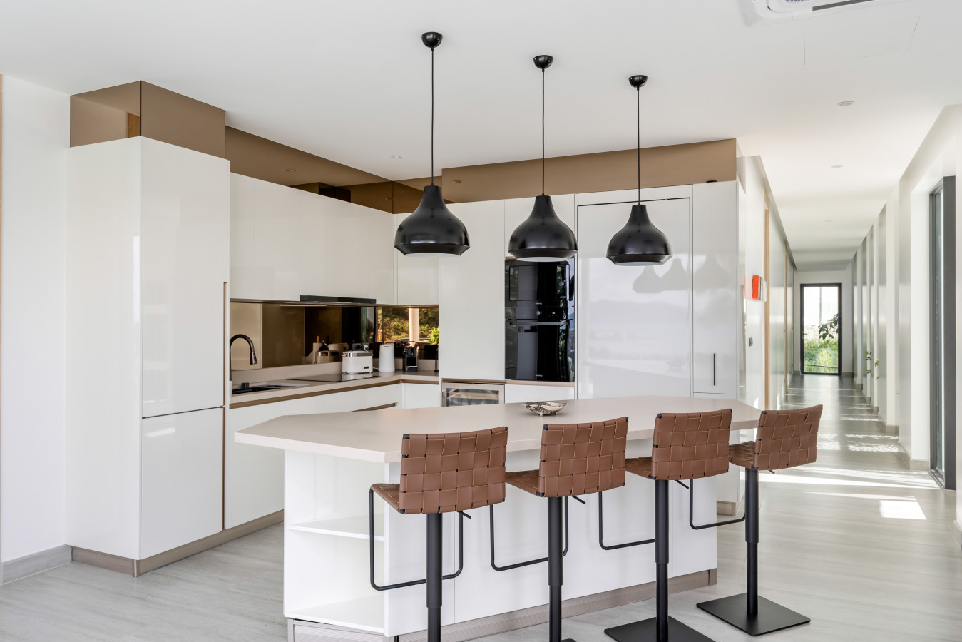Fully equipped modern kitchen with stylish pendant lighting