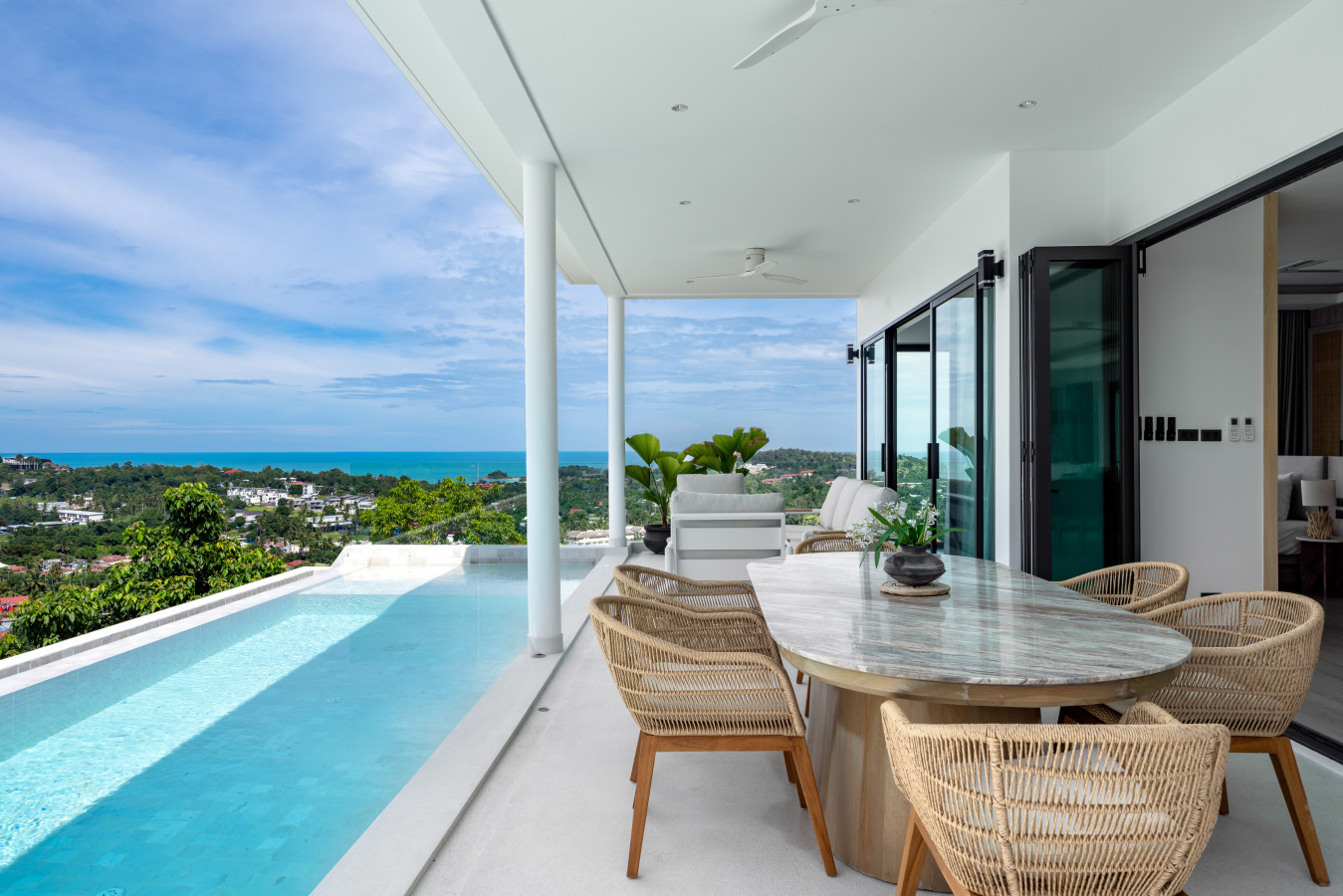 Outdoor terrace with comfortable seating and ocean panorama