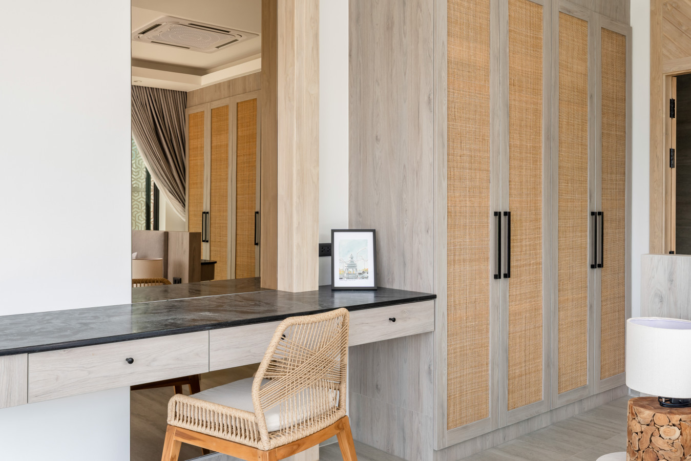 Modern kitchen with breakfast bar and designer pendant lights