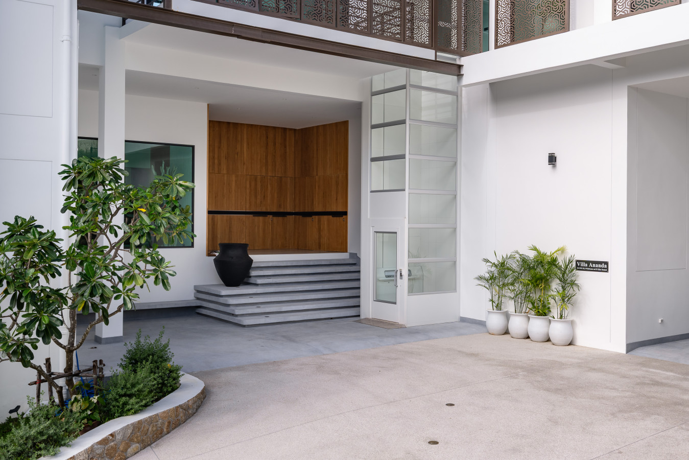 Elegant outdoor dining area with contemporary design and garden views