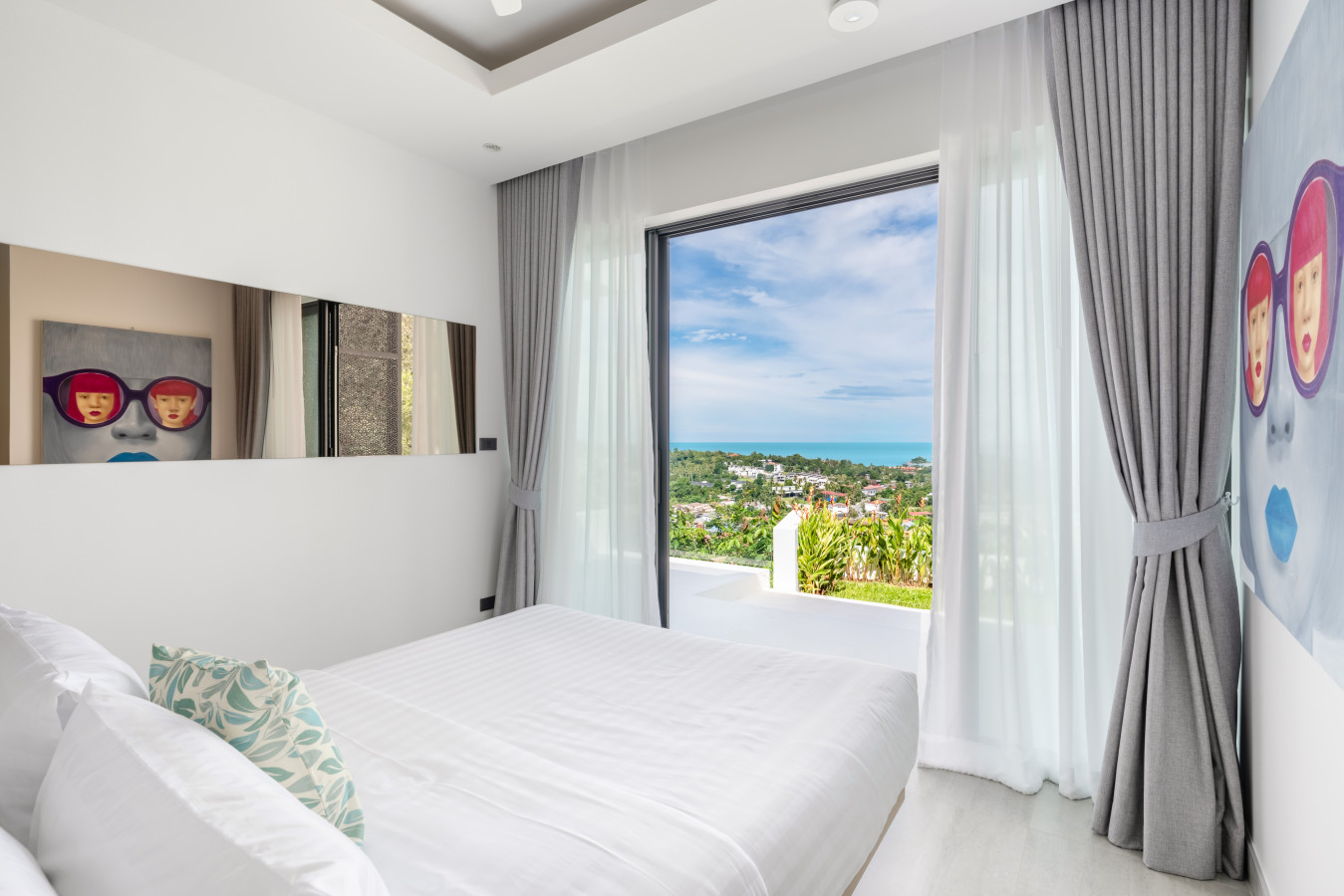 Airy bedroom with vaulted ceiling and stunning sea views