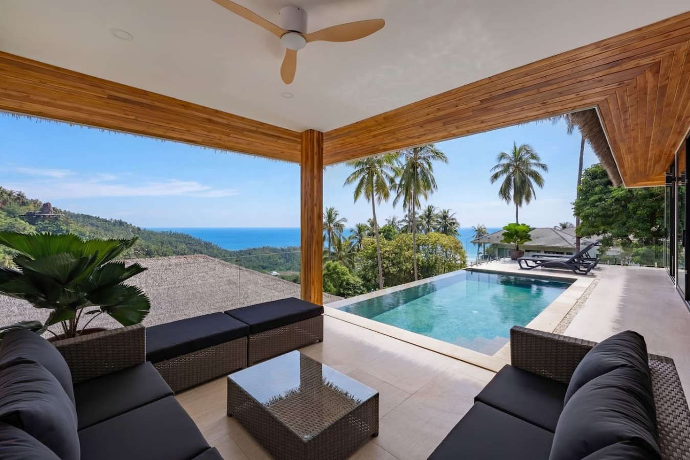 Al fresco dining area overlooking the pool and tropical gardens at Koh Samui vacation villa