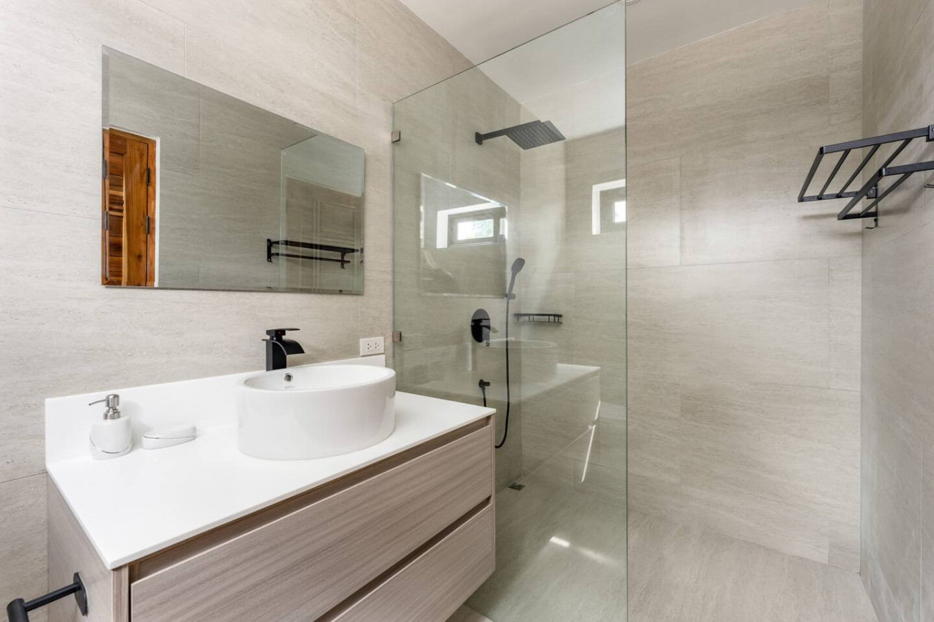 Bright ensuite bedroom with garden views and ceiling fan at Sunrise Hill Villa Koh Samui