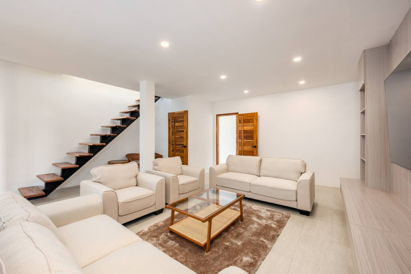 Light-filled family lounge with comfortable seating and modern interior, Koh Samui vacation rental