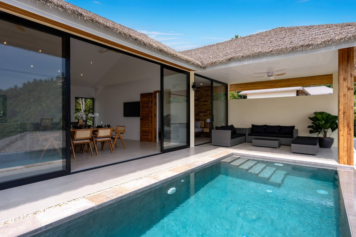 Modern poolside retreat with contemporary design and sun loungers at Koh Samui hillside villa