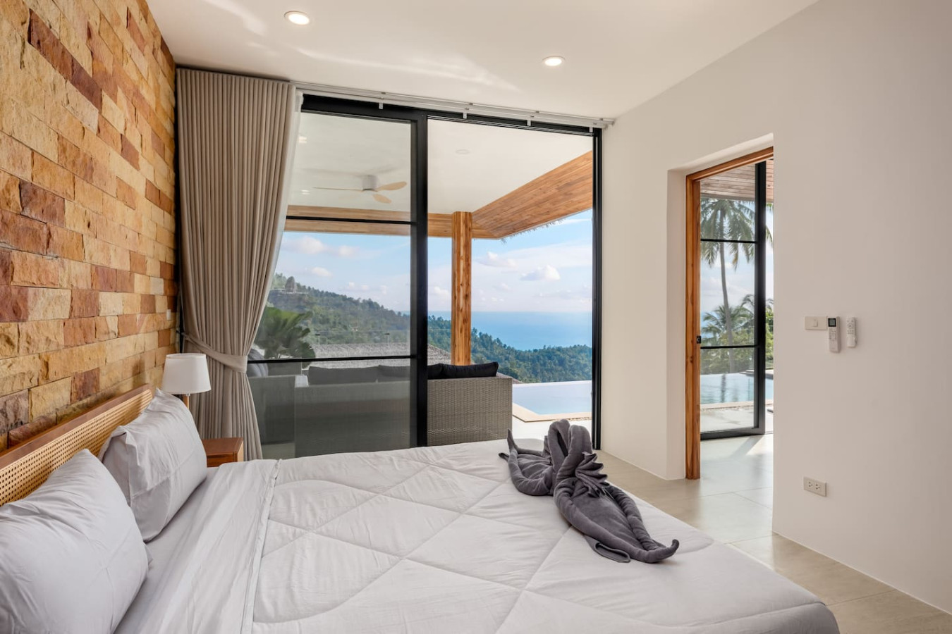 Stylish guest bedroom with garden access and tropical decor at Sunrise Hill Villa Koh Samui