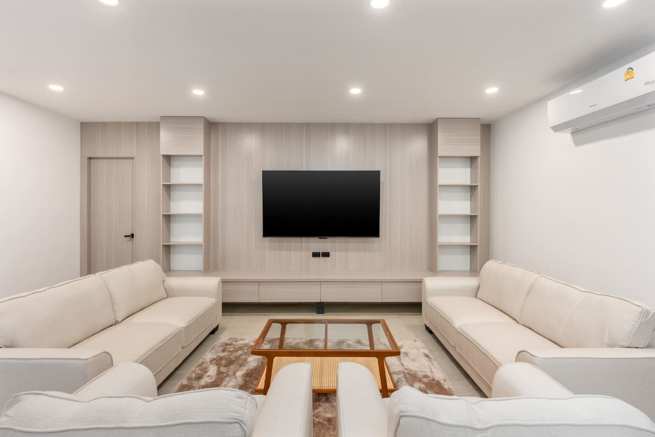 Spacious modern living room with plush sofas and minimalist decor at Koh Samui holiday villa