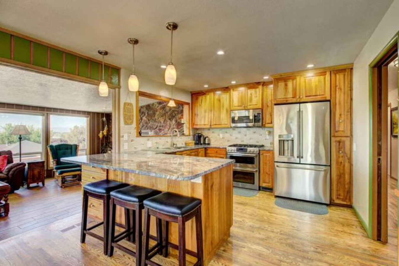 Open kitchen with bar stools