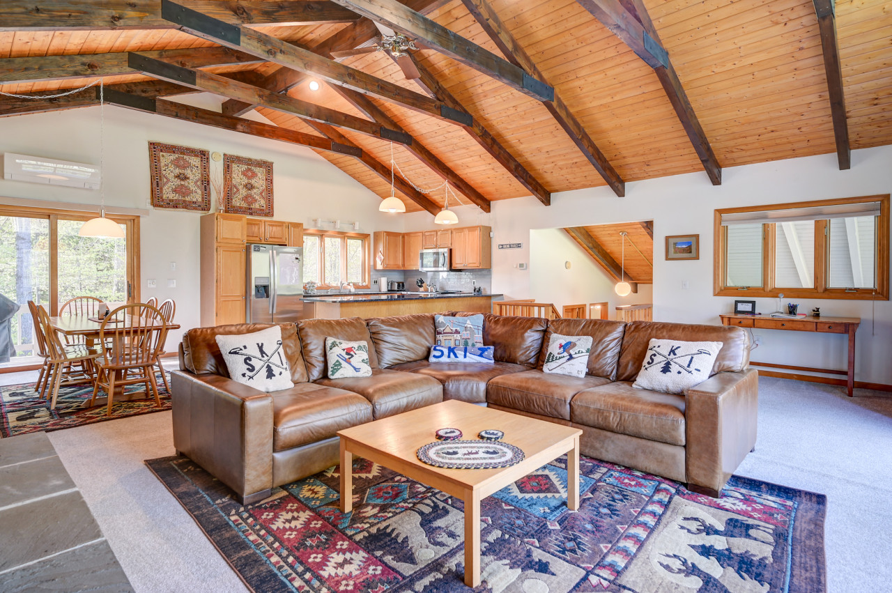Spacious open floor den area where families can sit back and relax with a nice fire.