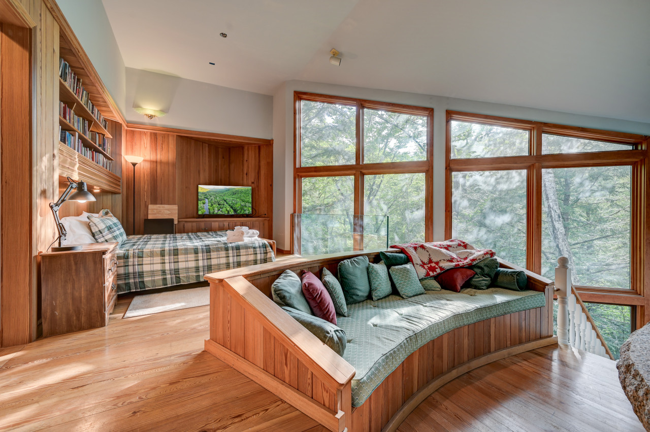The master ensuite includes a sitting area, TV, and a private bathroom