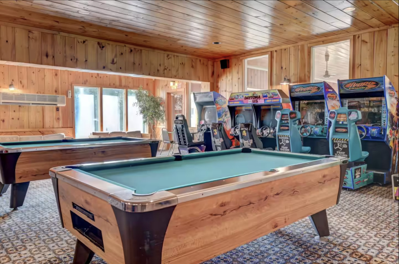 A BIG game room with pool tables and a lot of arcade games!