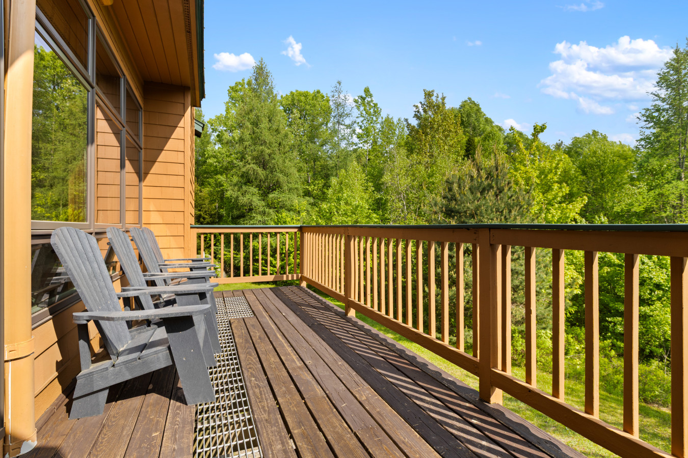 Step onto the deck, sink into an Adirondack chair, and enjoy peaceful views of the surrounding trees and sky.