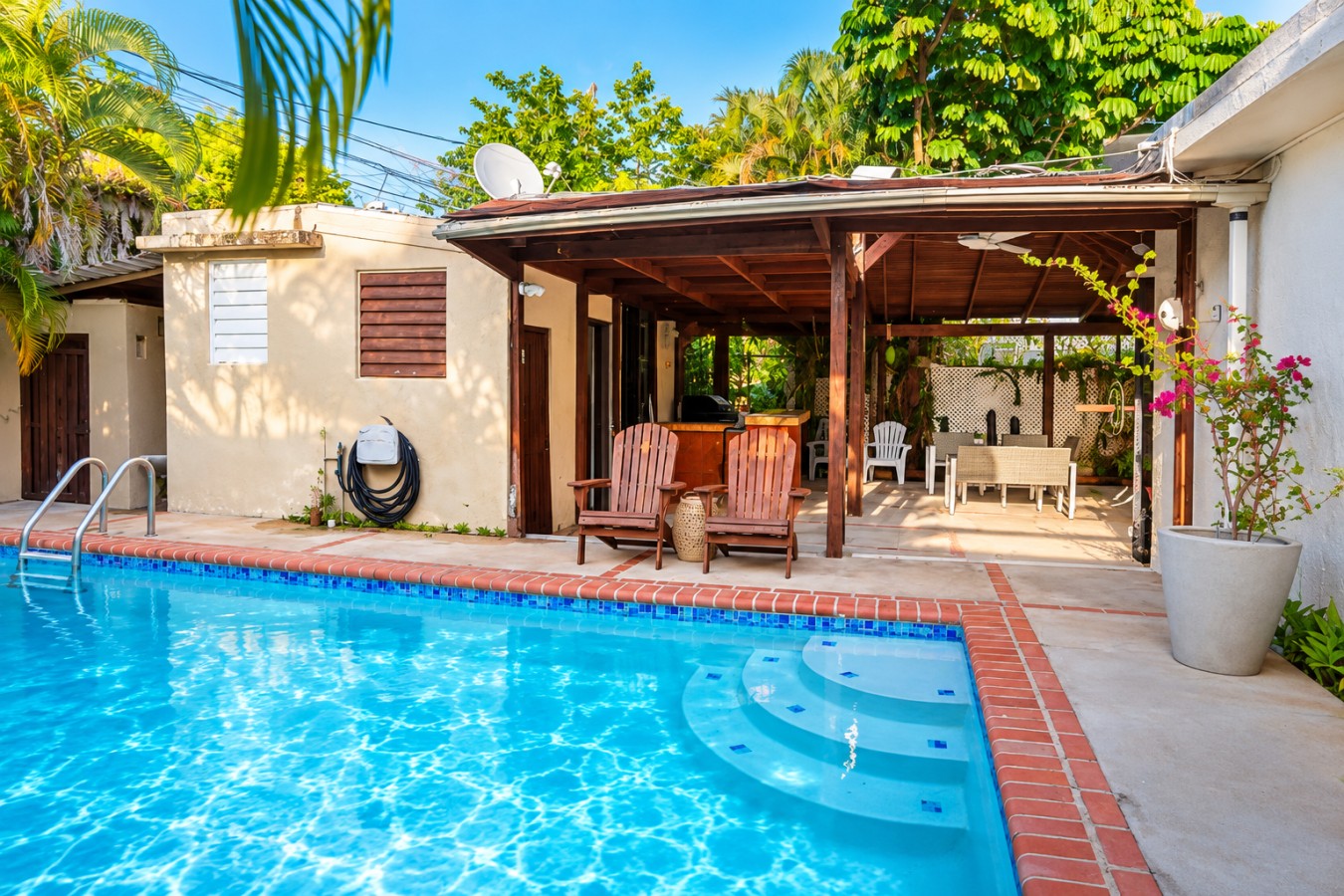 Step from the covered patio directly into your private pool, with plenty of space to lounge, dine and enjoy the tropical San Juan setting.