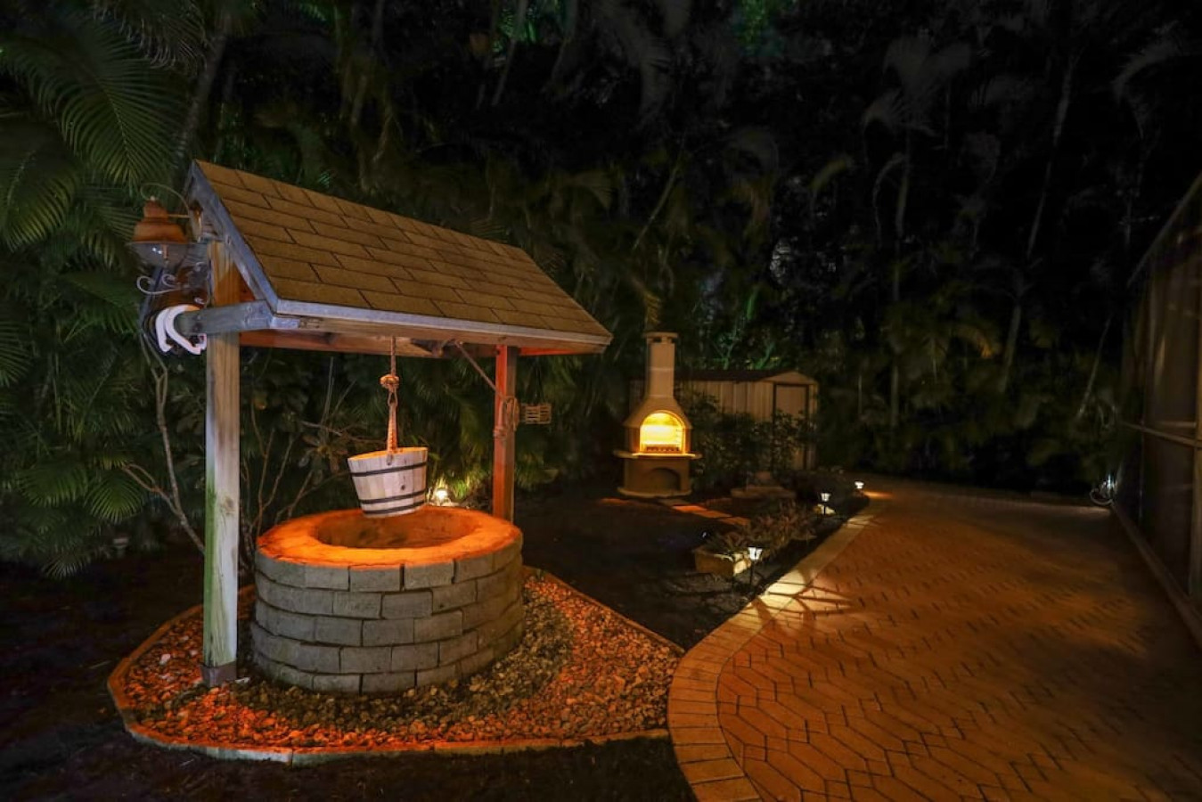 Make a wish at the faux wishing well or gather near the glow of the wood burning chiminea