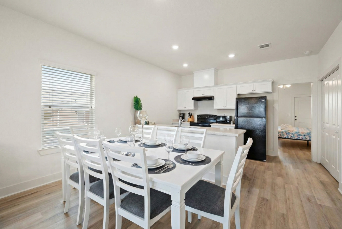 The dining area is located next to the kitchen