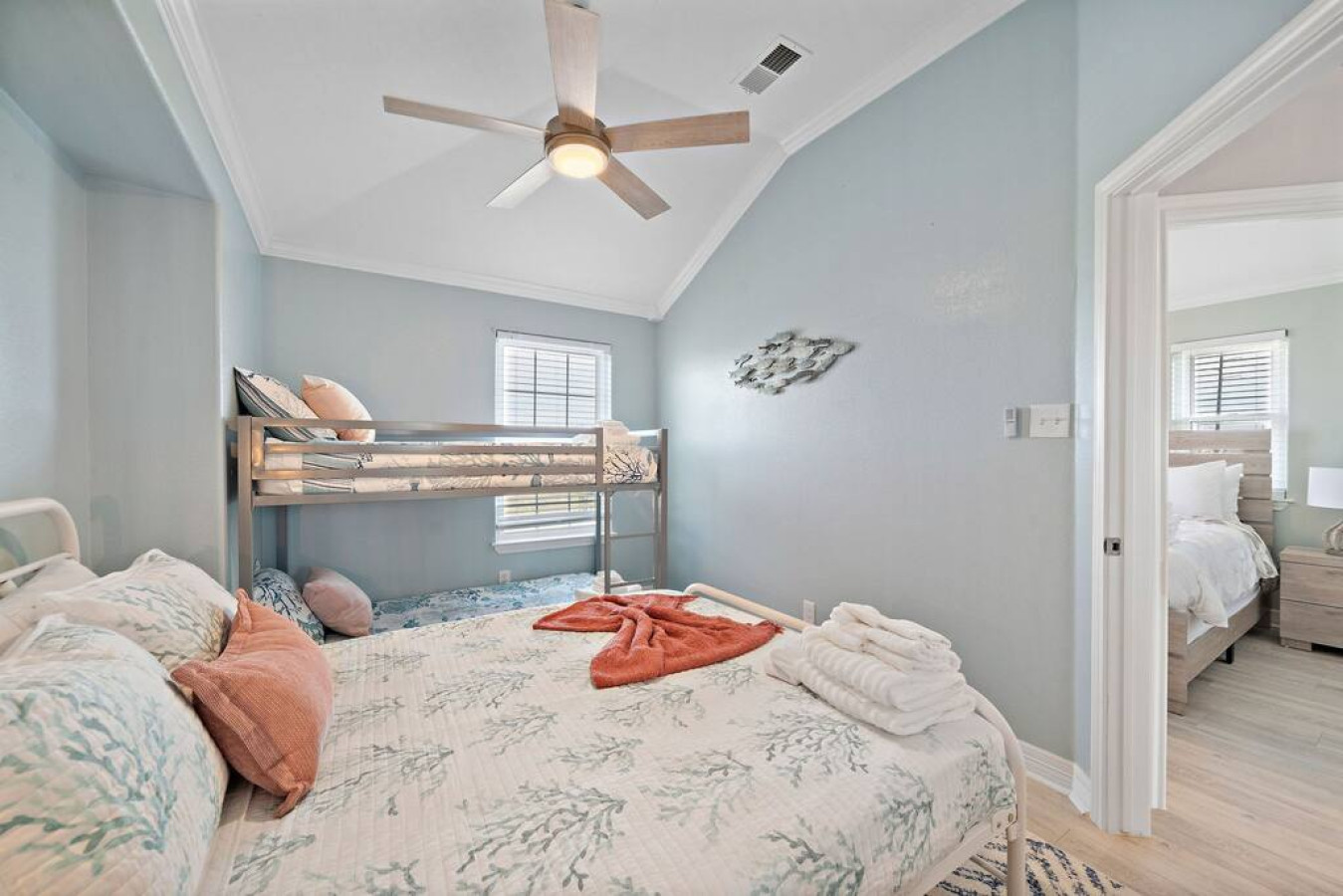 Your personal escape into the lap of bedroom luxury with this queen bed and full-sized bunk beds