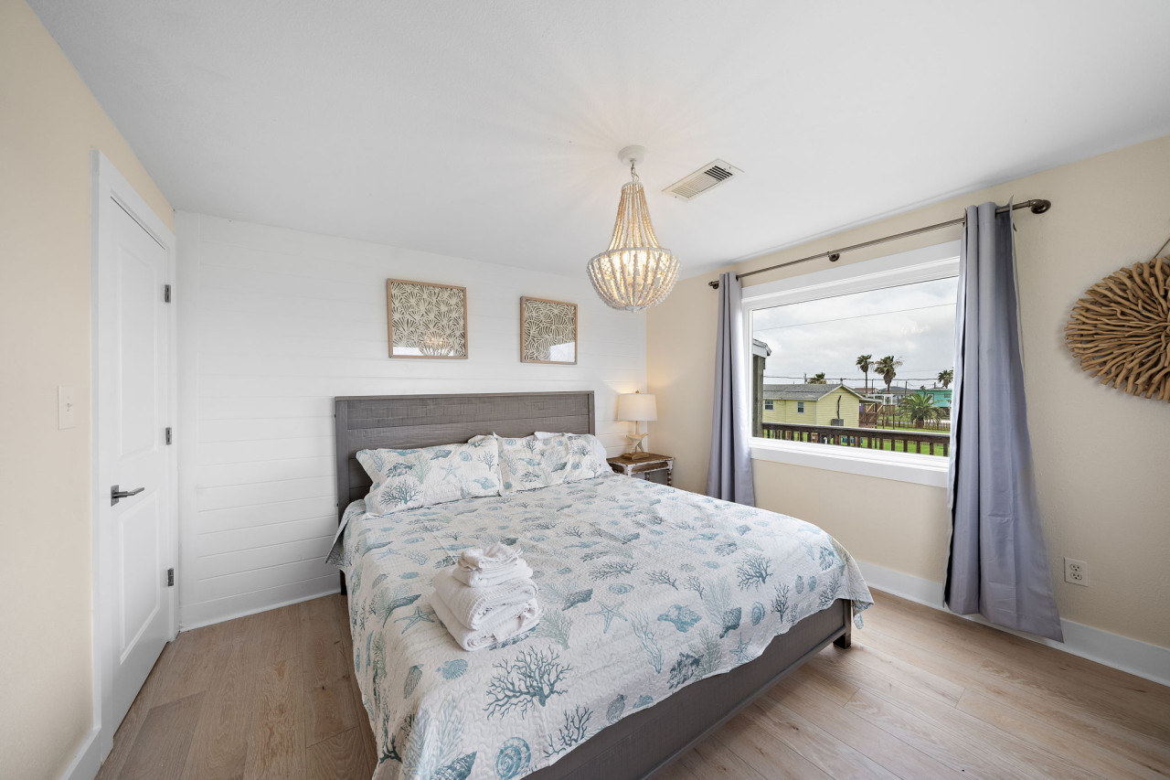 The primary bedroom with a king sized bed