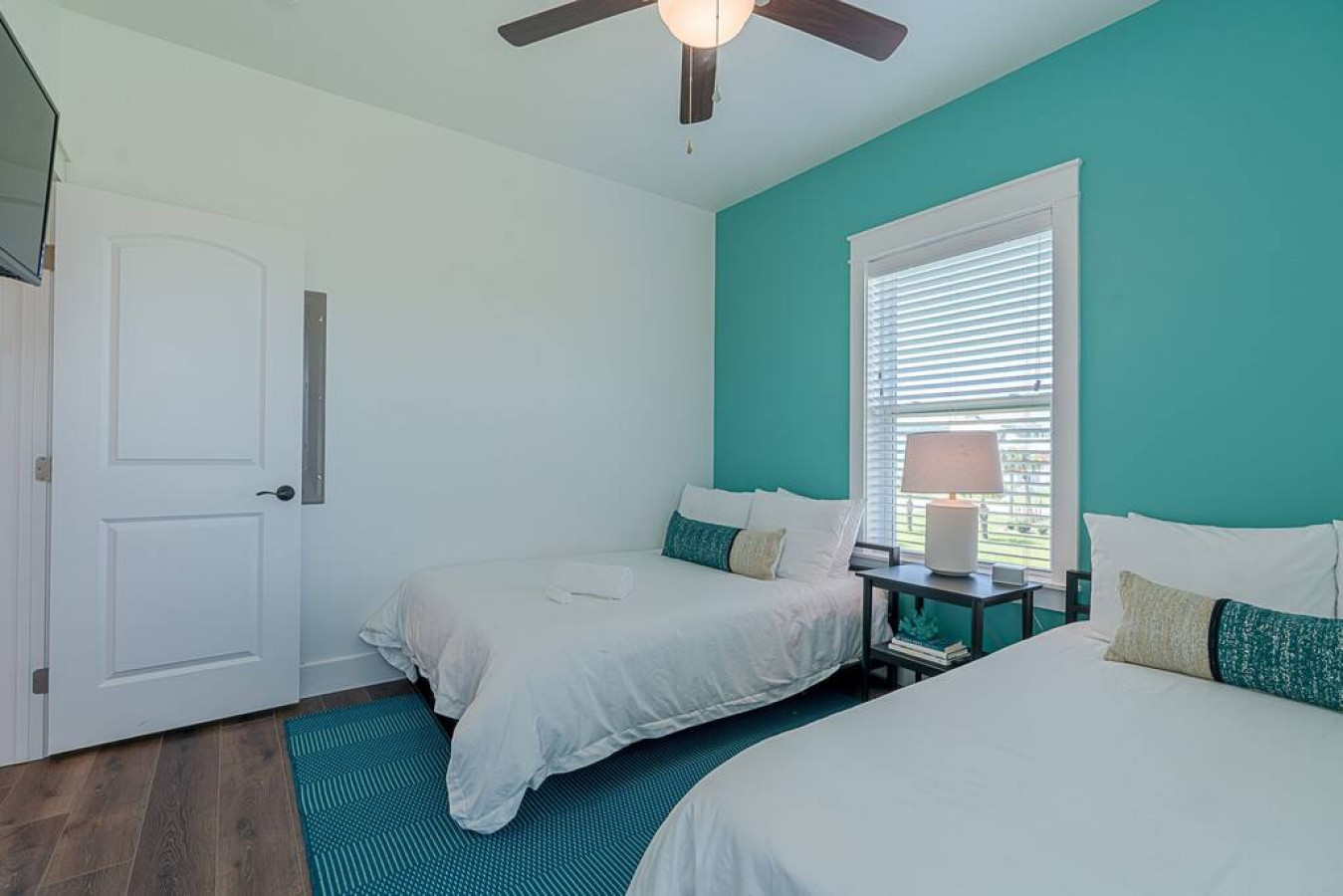 This bedroom has 2 queen-sized beds
