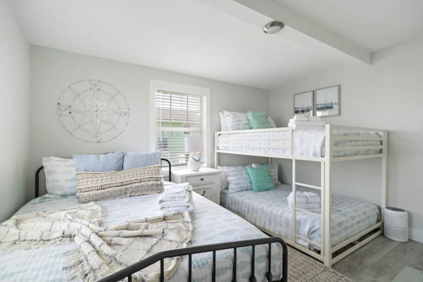 This bedroom includes 1 queen and 1 full/full bunk bed