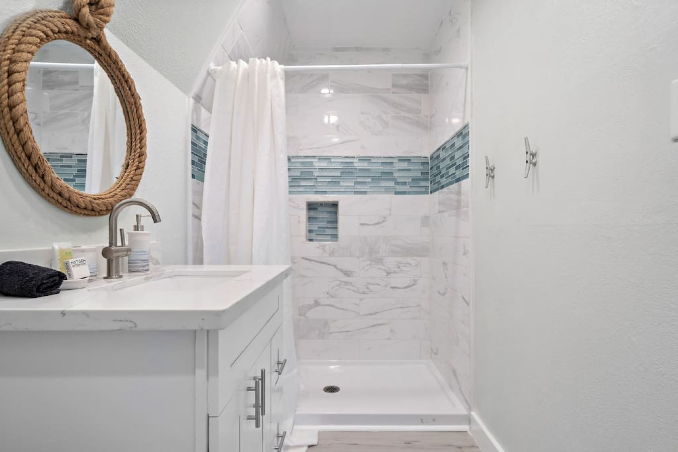 Soothing ambiance and well-planned details define this bathroom oasis