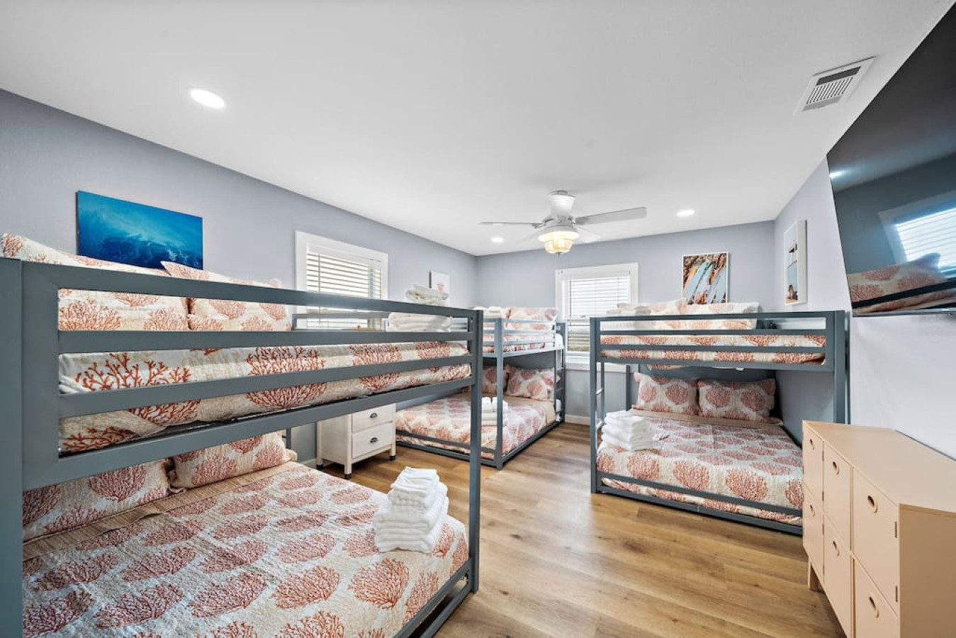 This bedroom has 3 sets of full bunk beds